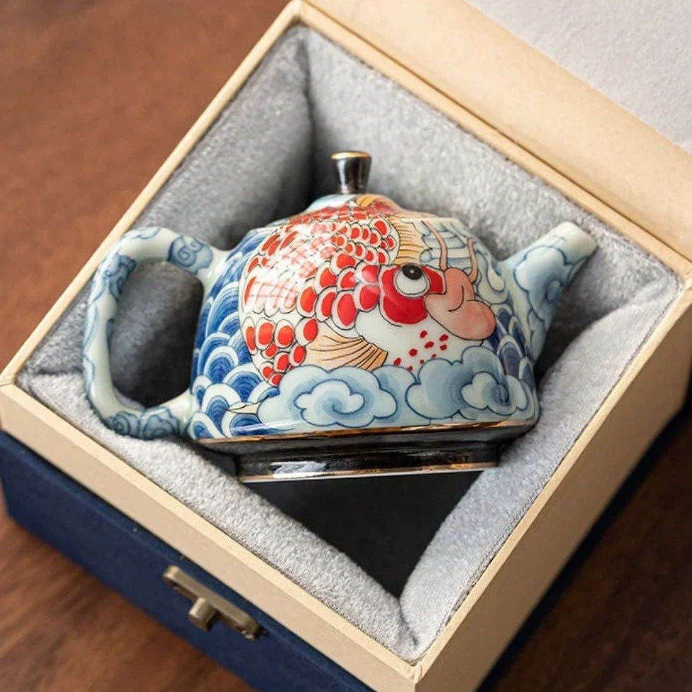 Théière en porcelaine décor sous glaçure avec infuseur